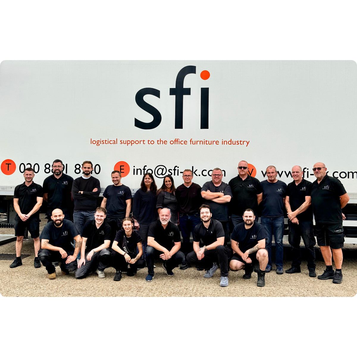 SFI team group photo standing in front of lorry